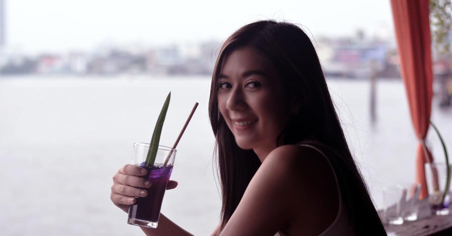 thai woman with a drink